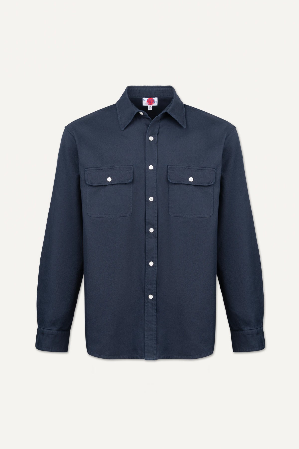 A dark navy blue long-sleeve button-up shirt with two buttoned chest pockets, displayed on a clean, light off-white background.
