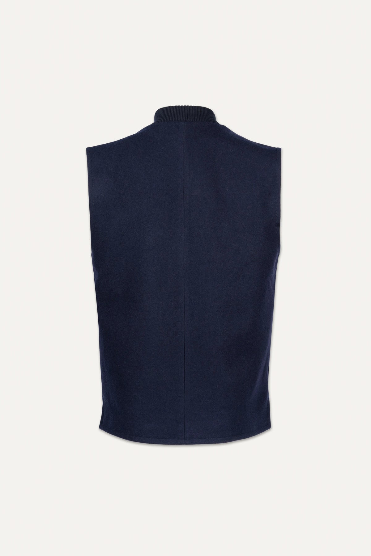 A sleeveless navy blue knit vest shown from the back, featuring a high folded collar and a central seam, set against a plain off-white background.