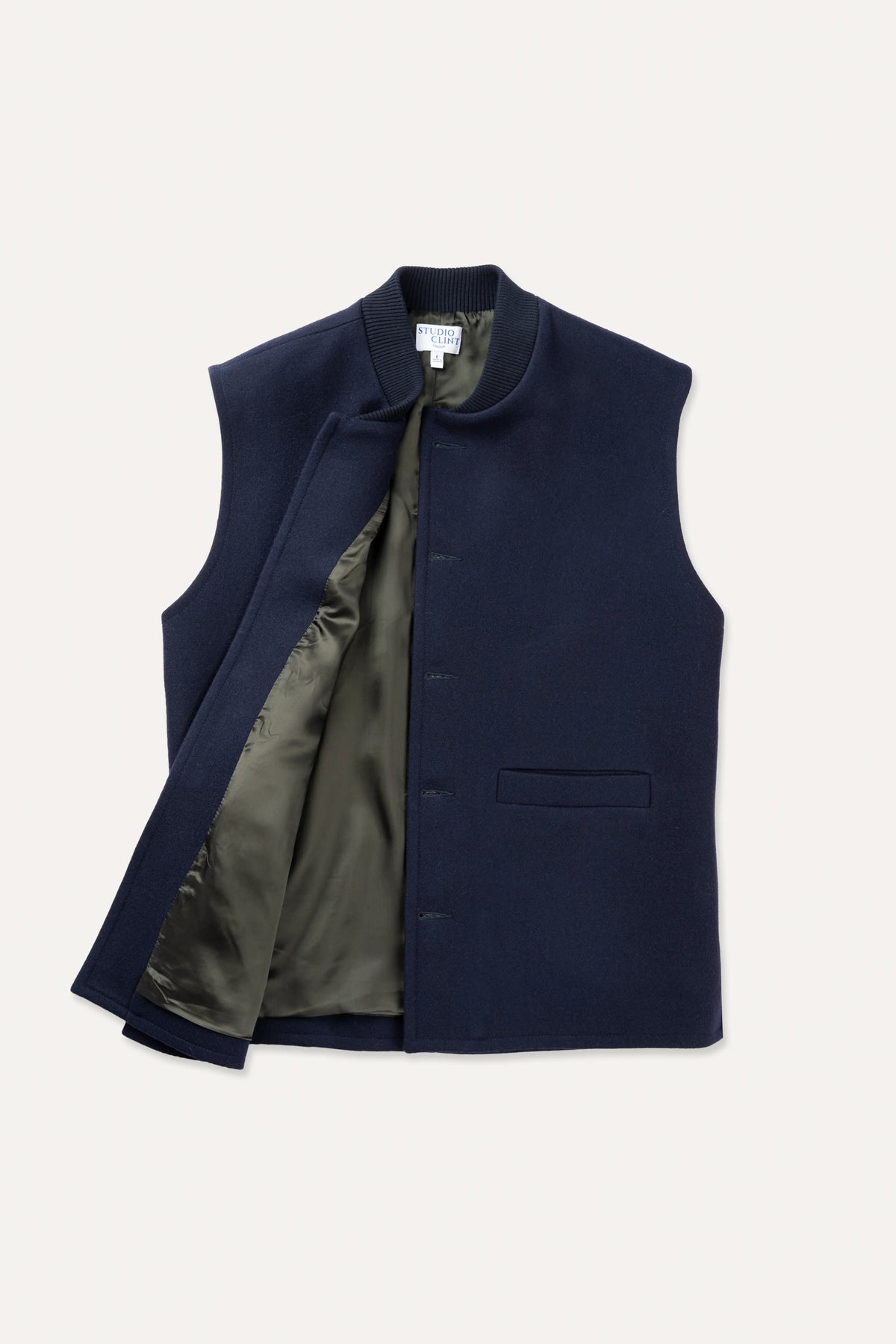 A midnight navy loden-wool vest shown flat, highlighting the ribbed collar and front button closure.